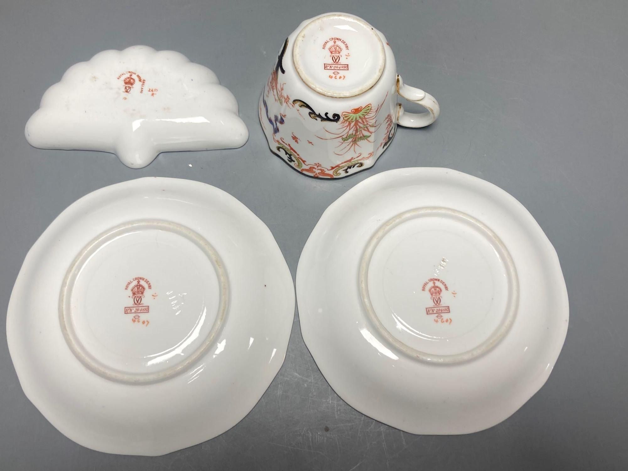 Two Royal Crown Derby Imari pattern plates, three Crown Derby plates or saucers, a Royal Crown Derby cup and two saucers and two Red Av